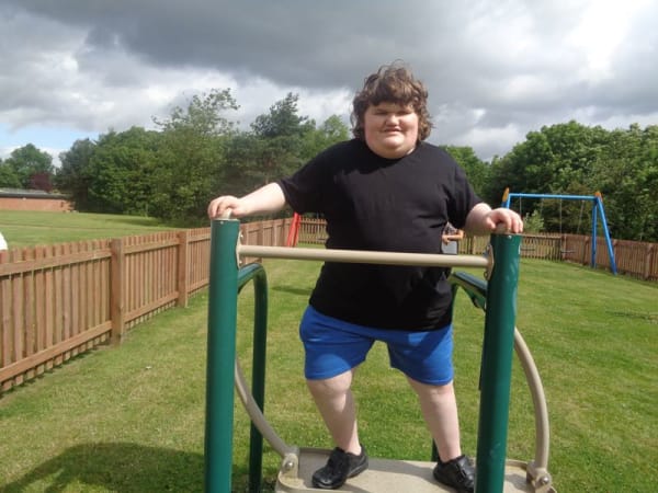 Daniel on the outdoor gym equipment